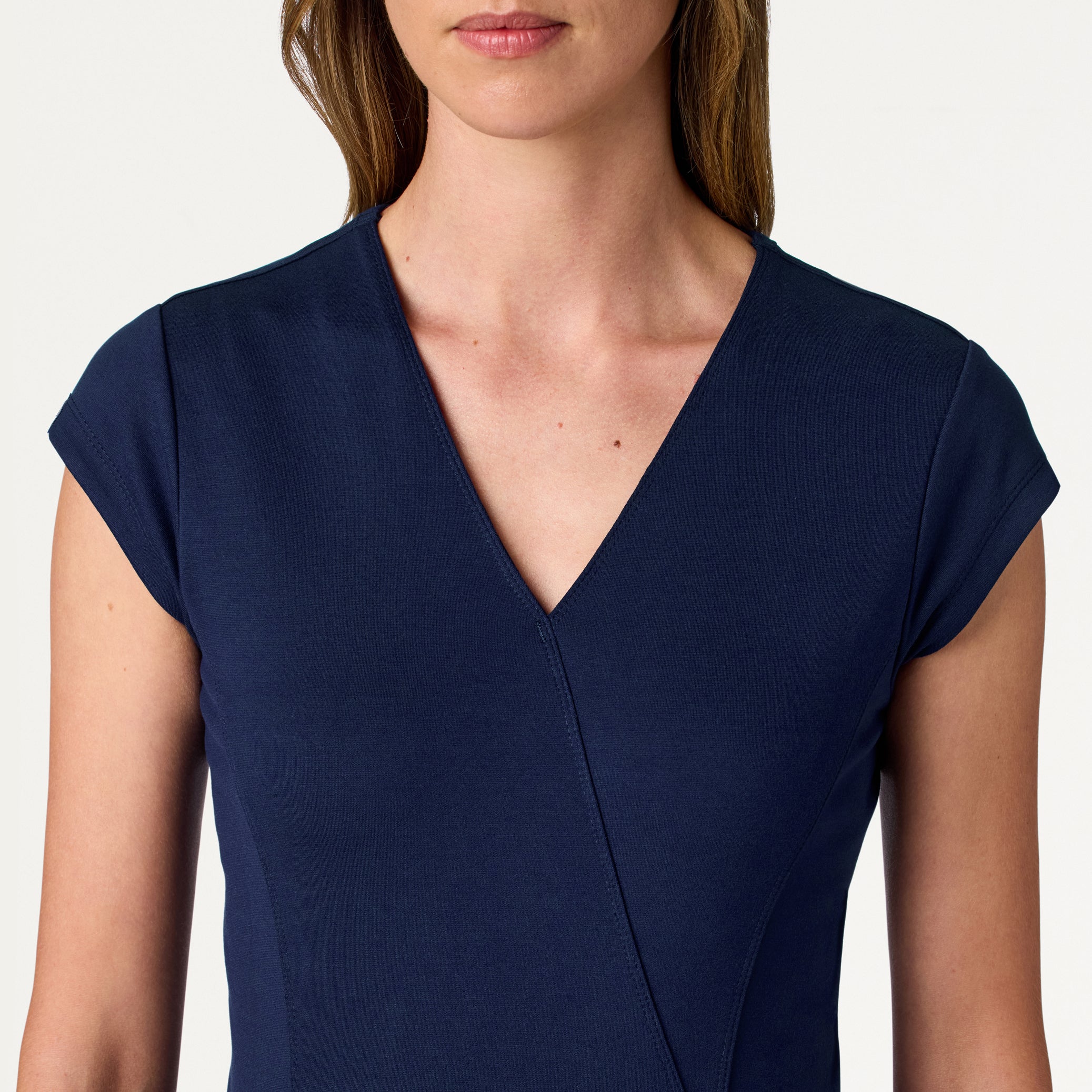 Isla Mock-Wrap UltraSOFT™ Scrub Top - Midnight Navy on-body detail